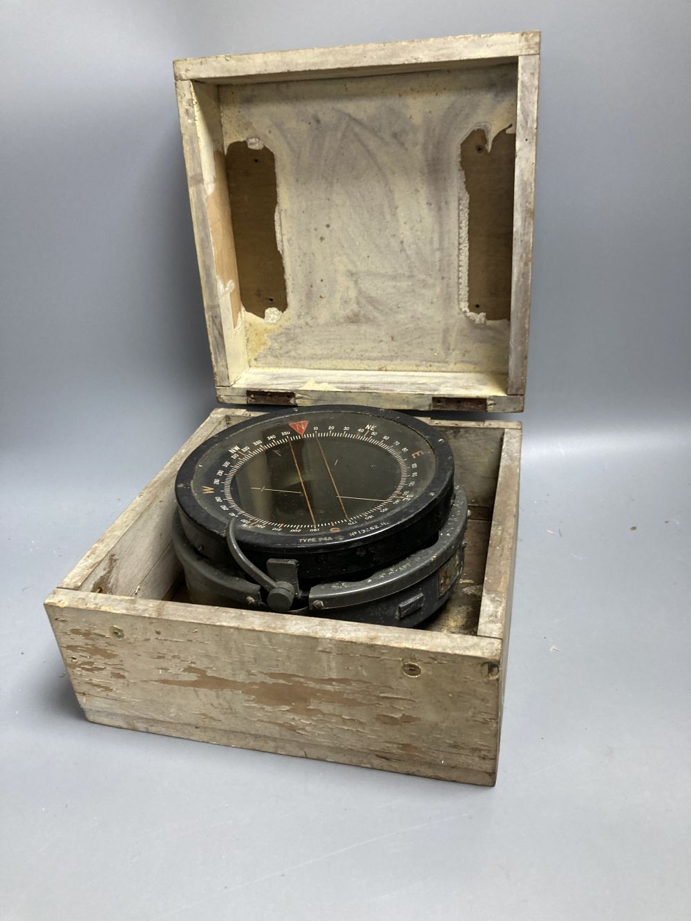 An Air Ministry Astro compass MkII, a similar compass, both cased, a Hydrographic Office Star Identifier and spare Azimuth circle compa